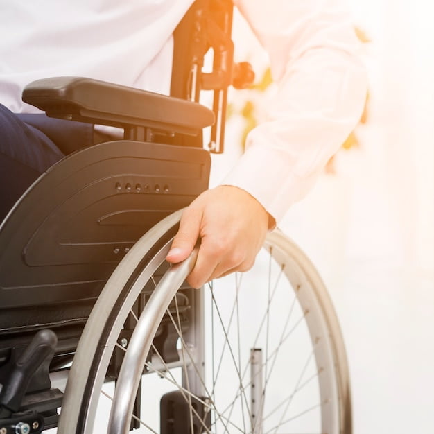 close-up-businessman-s-hand-wheel-wheelchair_23-2148127354 close-up-businessman-s-hand-wheel-wheelchair_23-2148127354